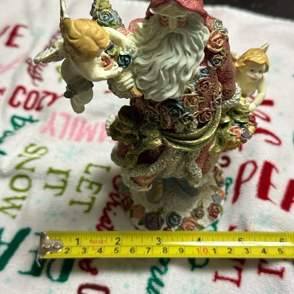 Festive Santa Figurine with Cherubs